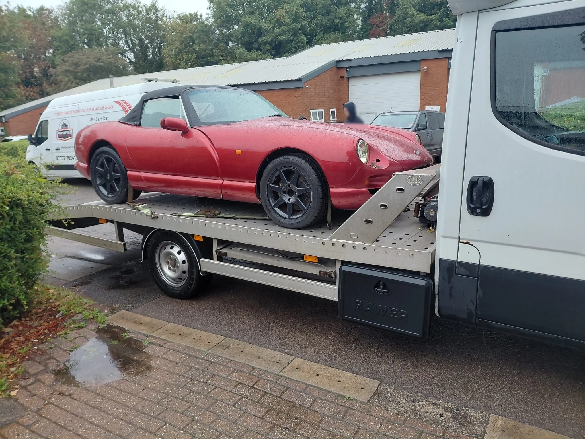 Classic red TVR convertible loaded on the recovery transporter